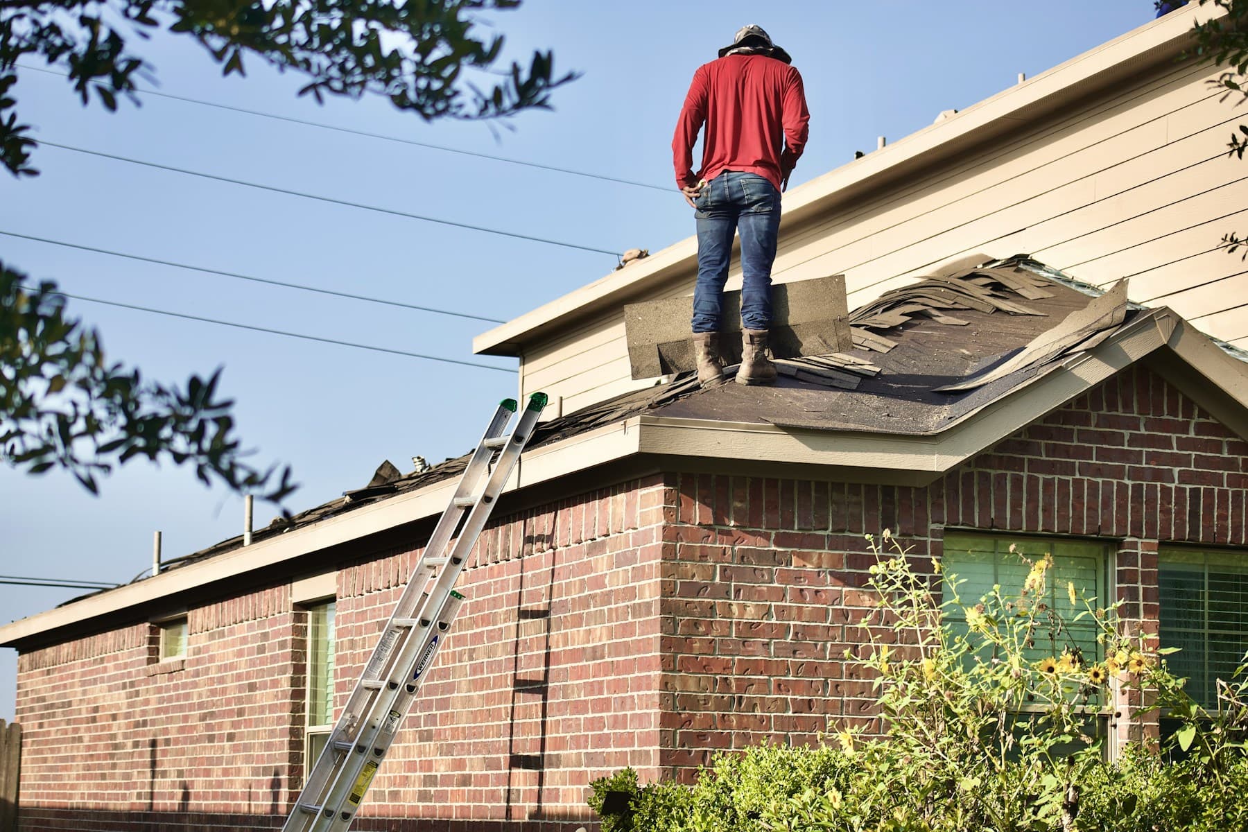 Roofing professional working on a residential roof