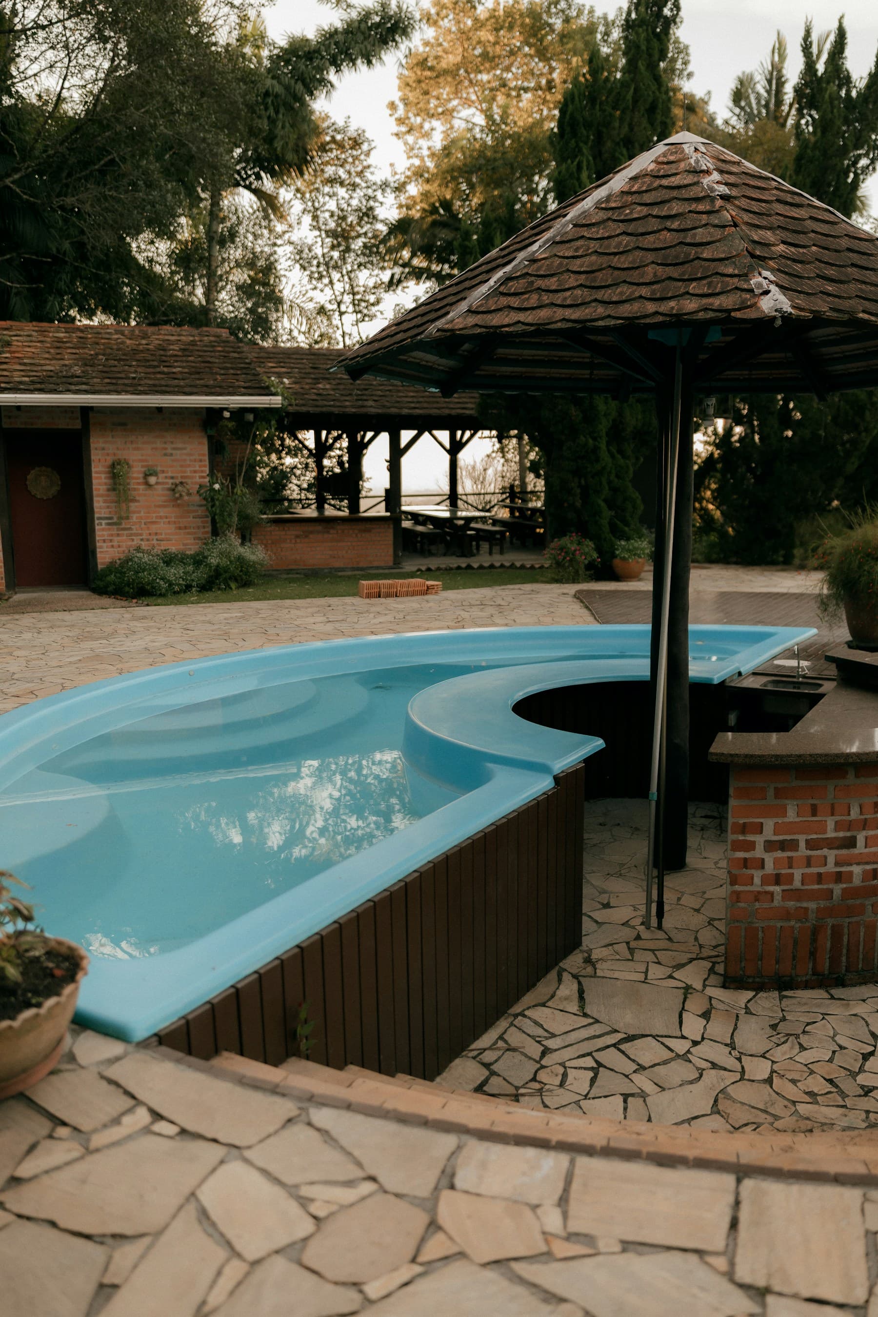Bright backyard swimming pool with blue water